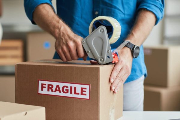 man-packing-box-close-up.jpg